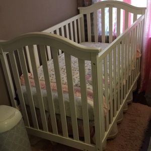 White Crib , with 4 piece crib set . heart pink